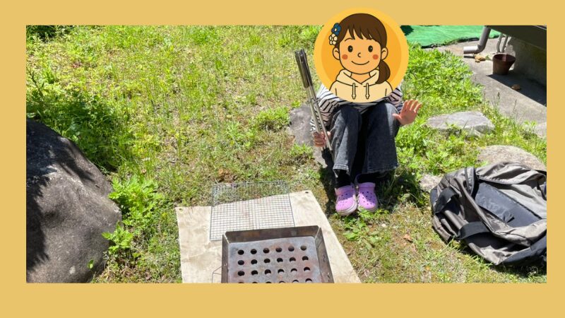 長女と焚き火台の写真